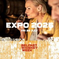 Woman nosing a Dunville's whiskey glass at Belfast Whiskey Week Expo 2025, taking place Friday 25 July