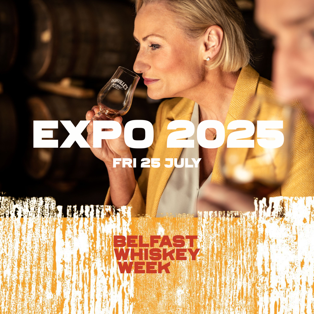 Woman nosing a Dunville's whiskey glass at Belfast Whiskey Week Expo 2025, taking place Friday 25 July