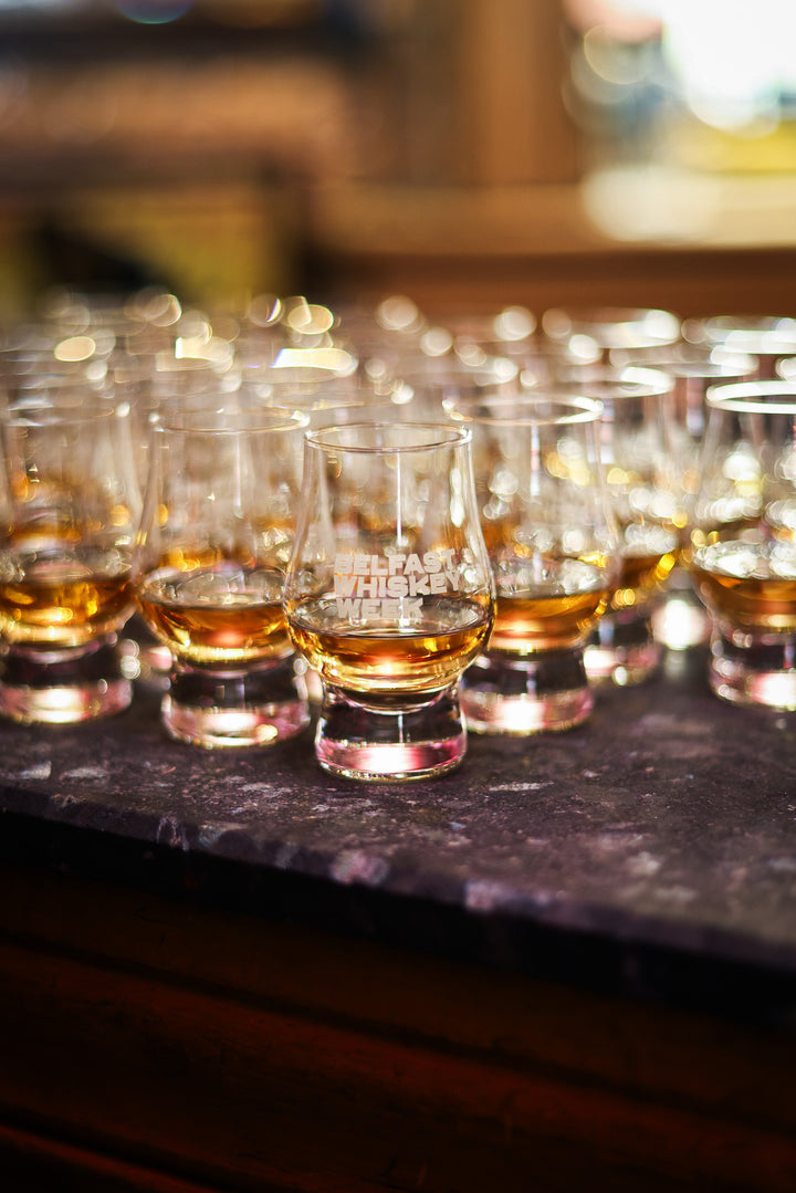 Belfast Whiskey Week tasting glasses of whiskey lined up on the bar