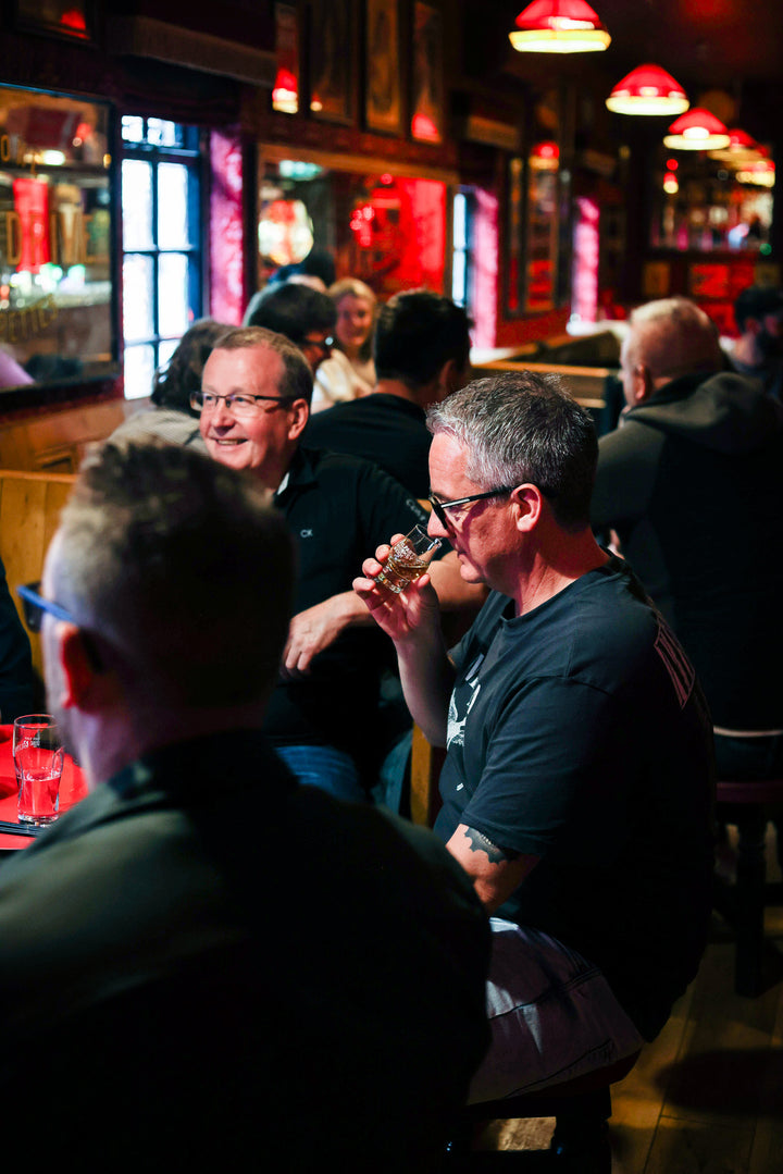 Guests nosing drams at a Belfast Whiskey Week tasting