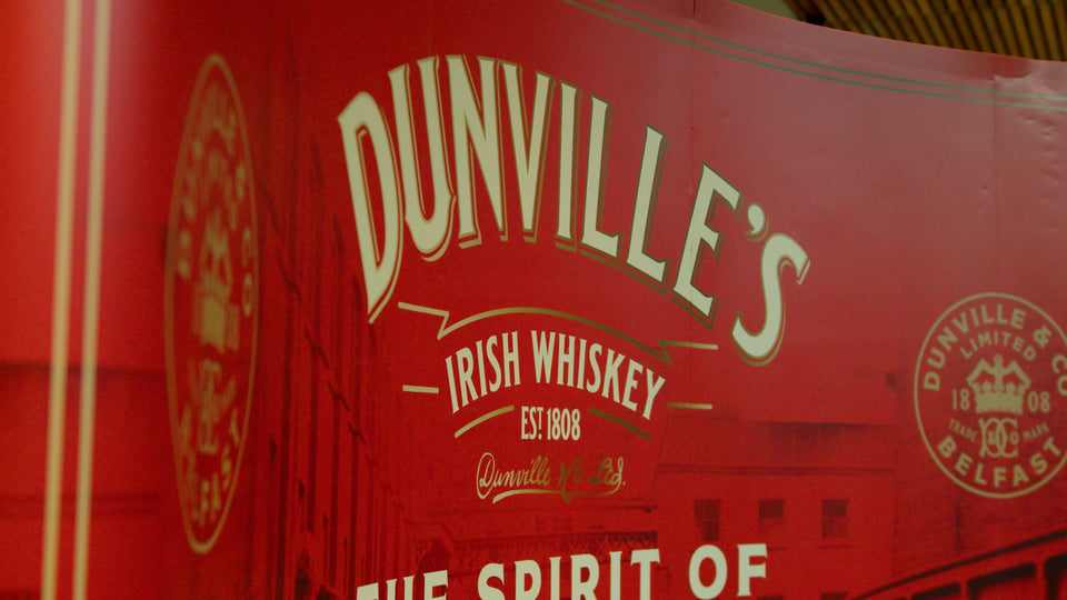 Dunville's Irish Whiskey established 1808 branded red signage at a Belfast whiskey festival