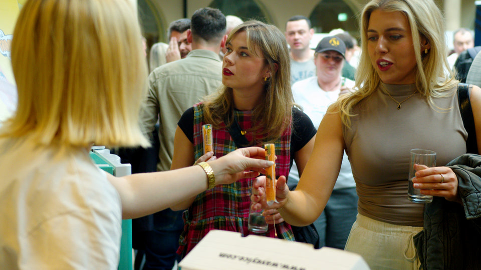 Guests receiving Wavey Ice lolly samples at a busy Belfast Whiskey Week festival tasting event
