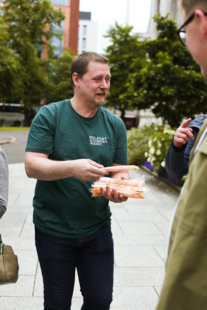 Another host handing out whiskey ice pops – fun tour snack element