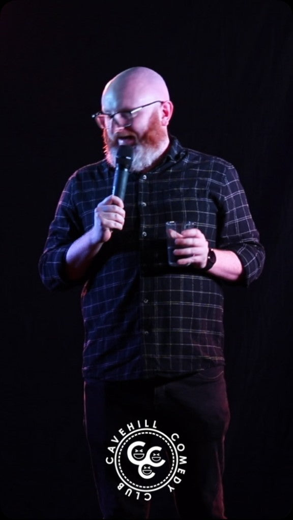 Stand-up comedian Alan Irwin performing at Cavehill Comedy Club during Belfast Whiskey Week