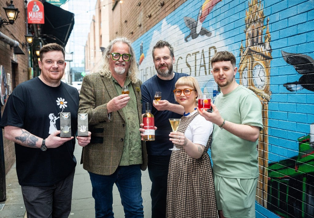 Belfast Whiskey Week team posing with Morning Star Irish Whiskey in a Cathedral Quarter alleyway