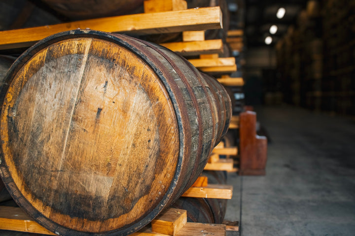 Close-up of an oak whiskey cask in the Hinch Distillery warehouse