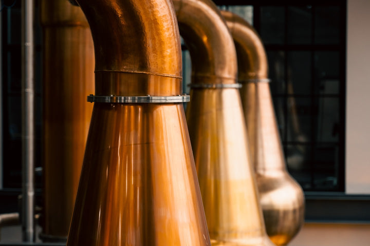 Copper pot stills in the stillhouse at Hinch Distillery