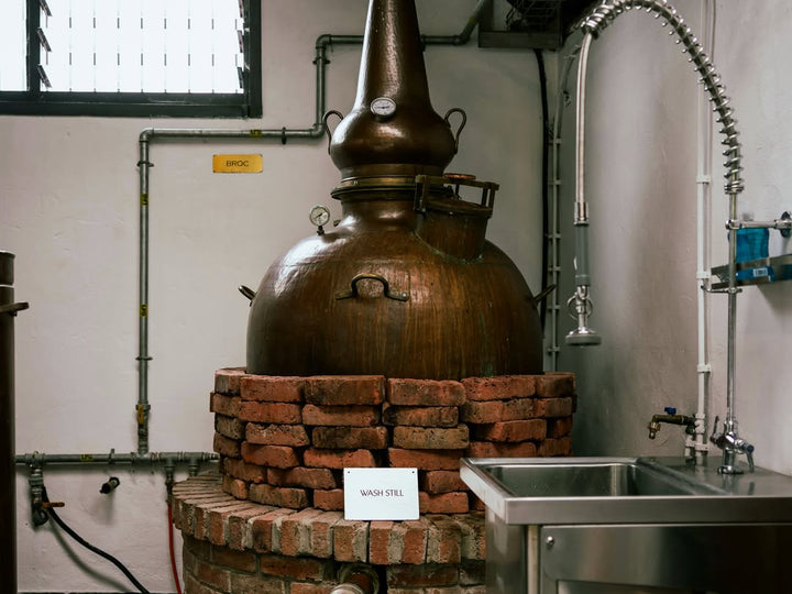 Killowen Distillery's direct-flame copper wash still on its brick hearth